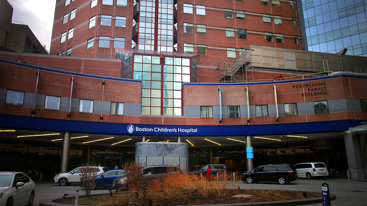 Boston Children's Hospital, the latest to change its policies on intersex surgery. Photo shows the outside of a hospital with cars lining up outside.